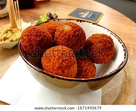 A bowl of typical dutch snack bitterballen Royalty-Free Stock Photo #1871490679
