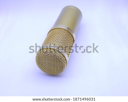 golden professional recording condenser microphone. isolated on white.