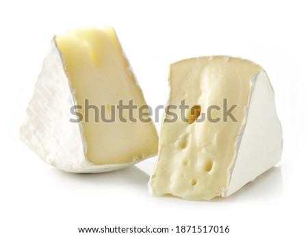 pieces of fresh brie cheese isolated on white background Royalty-Free Stock Photo #1871517016