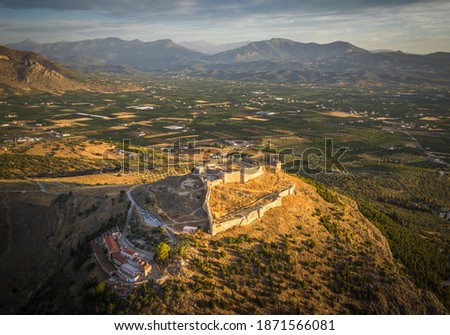 The castle on Larissa Hill, located near the town of Argos, Greece on sunrise light aerial view Royalty-Free Stock Photo #1871566081