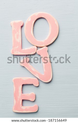 Message of love with wood pink letters.