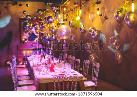 Decoration interior elements of restaurant venue banquet hall with multicoloured different helium balloons, on a indoor corporate event or wedding reception or birthday party celebration Royalty-Free Stock Photo #1871596504