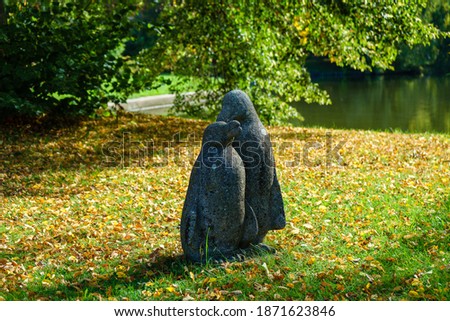 A beautiful shot of a penguin statue in the park