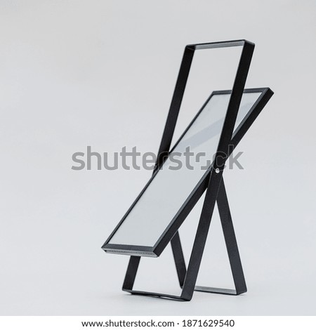 A vertical photo frame on a gray background