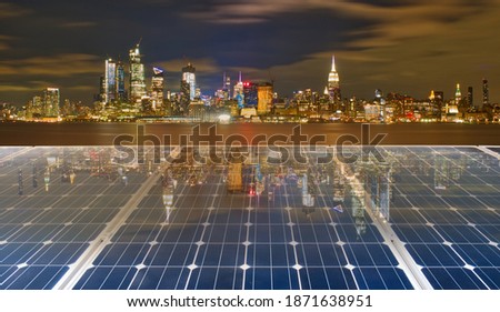 Solar panel over cityscape nightlight background. solar power green energy for life concept, City scape New York Skyline.
