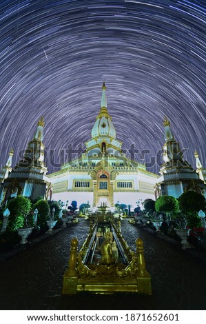 The Phra Maha Chedi Chai Mongkol is one of the largest chedis (pagoda)and star trail background in Roi Et province, northeastern Thailand