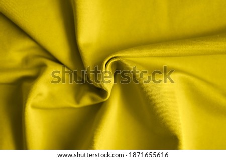 microfiber fabric background with pleats, top view, toned in illuminating and ultimate gray, color of the year 2021