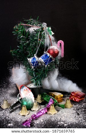 Decorated green Christmas tree with patchwork ornament artificial star hearts isolated on black background images