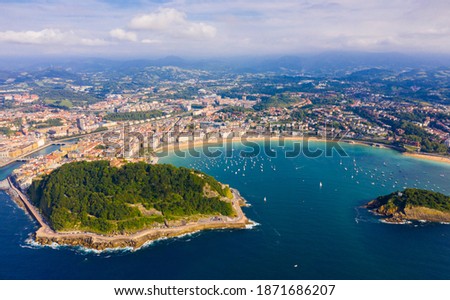 High view of San-Sebastian with Beach of La Concha and boats at sea, Spain
