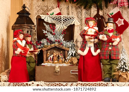Christmas decorations from dolls and sculptures in the interior of the cafe