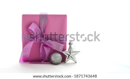 Pink boxes tied with ribbons on a white background. Christmas decorations. New Year gifts. Gift festive selection. long wide banner with copy space