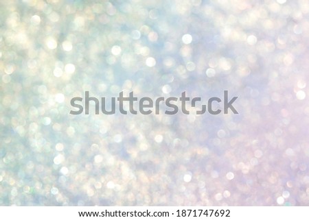 Christmas background, defocused lights, white and blue, pink, yellow bokeh