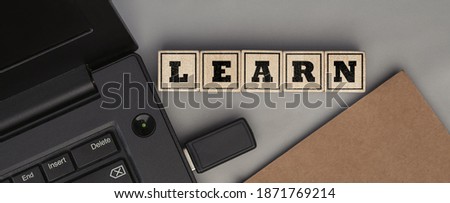The word LEARN made from wooden cubes. Conceptual photo. Top view