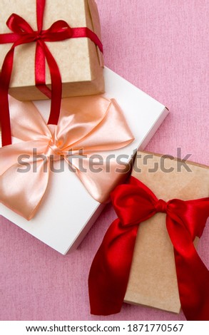 gift boxes with ribbons close-up, vertical