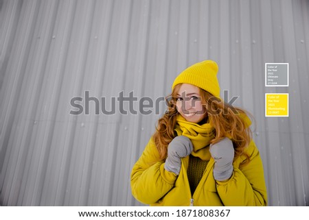 Colors of the Year 2021. Young happy optimistic  female wearing trendy winter clothes. Horizontal view copyspace.
