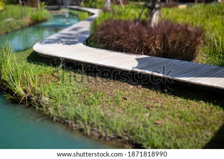 Simple walkway in summer rice field resort, stock photo