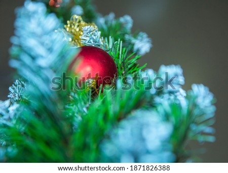 Blurred Christmas background. Merry Christmas and Happy New Year. Christmas tree, background with red ball 