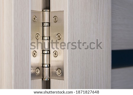 Brand new steel door hinge Royalty-Free Stock Photo #1871827648