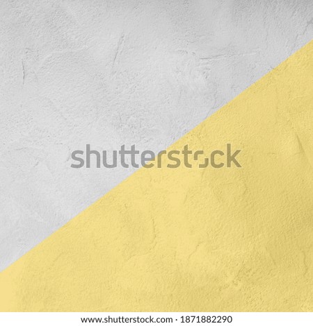 Illuminating yellow and gray textured painted concrete background. Trendy colors of the year. Square