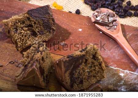 panettone and chocotone on rustic table. ingredients on the table