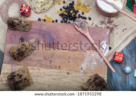 panettone and chocotone on rustic table. ingredients on the table