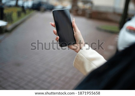phone in the hands of a girl mockup