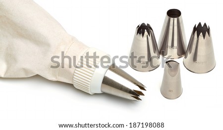 Cotton icing bag with pins or tips isolated on white background
