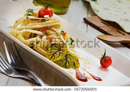 delicious fettuccine pasta with baby tomatoes 