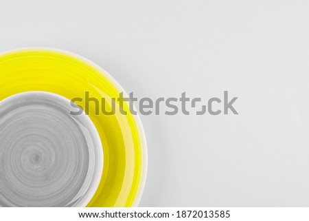 Illuminating and Ultimate gray color of the year 2021. Two plate on background. Food, kitchen, recipe concept. Top view, copy space