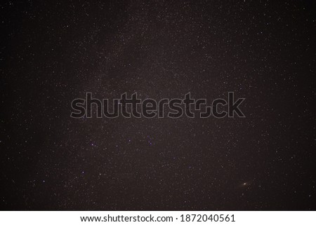 Andromeda galaxy on the night sky shining in darkness