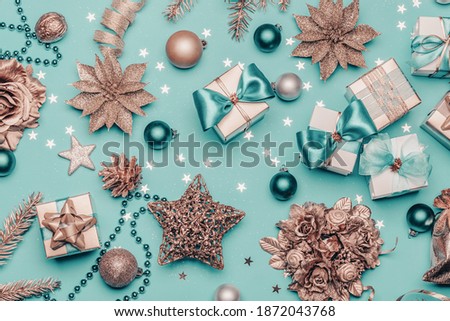 Turquoise christmas background with golden gift boxes and christmas decorations 