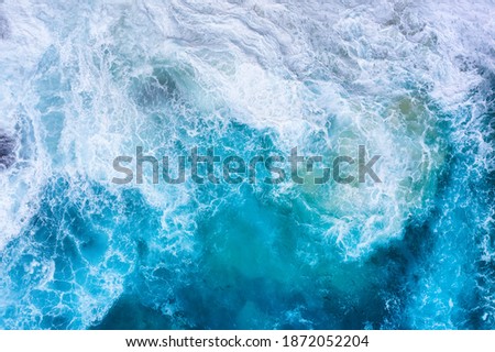 Ocean waves as a background. Blue water background from top view. Seacape from drone. Bali, Indonesia. Travel image
