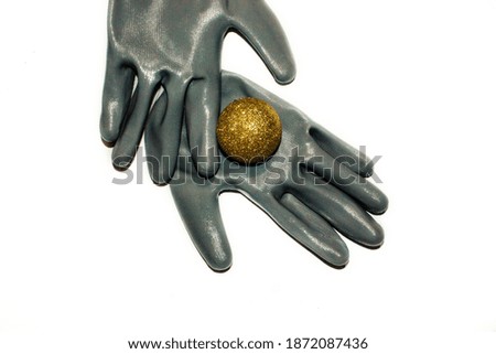 Nylon gloves with a Christmas ball on a white background