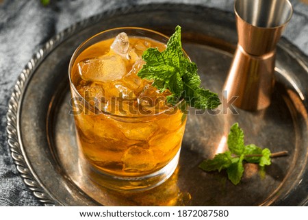 Boozy Refreshing Stinger Cocktail with Mint and Brandy Royalty-Free Stock Photo #1872087580