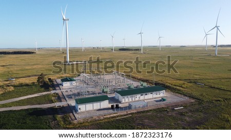 wind generators and substation with a colors sky Royalty-Free Stock Photo #1872323176