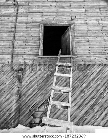 Ladder leaning against a barn loft