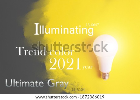 Color of the Year 2021.Glowing bulb on yellow background, uniqueness concept. Idea, innovation, creativity concept, design template, copy space.
