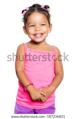 Cute multiracial small girl with a funny expression isolated on a white background