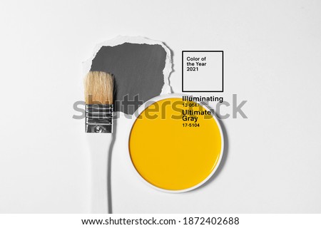 White brush on light background with trendy palette. Minimalistic picture for article, banner or poster. Gray and yellow - mod colors of 2021