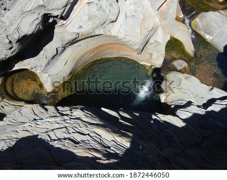 Natural pools and waterfalls among rocks at Hamersley Gorge (Minhthukundi), Karijini National Park, Western Australia