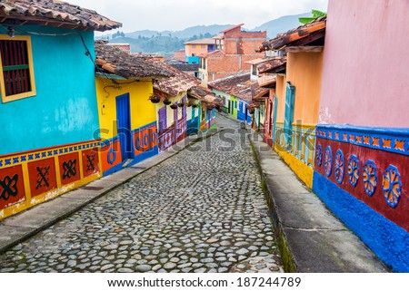 Colorful colonial houses on a cobblestone street in Guatape, Antioquia in Colombia Royalty-Free Stock Photo #187244789