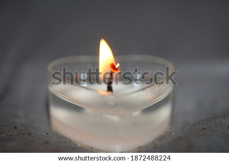 Burning heart shape romantic candle close up background modern high quality stock photography prints