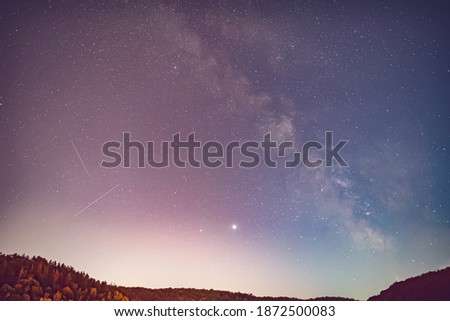 Saturn, Jupiter and Milky Way in the night sky.