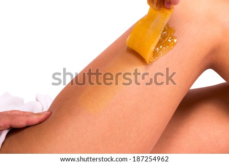 Epilation with liquate sugar at legs Royalty-Free Stock Photo #187254962