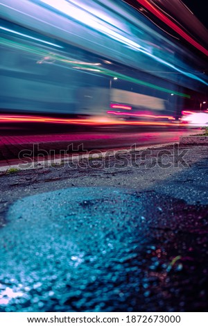 Long exposure photography traffic in the city Rome colorful bus and cars lights Royalty-Free Stock Photo #1872673000
