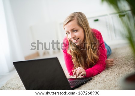 beautiful young woman searching information on internet