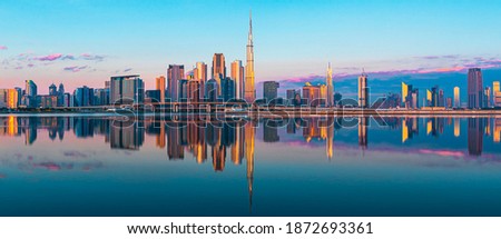 Sunrise  view on Dubai city center skyline from Dubai harbour, United Arab Emirates