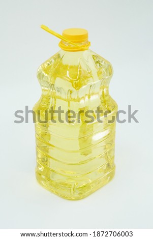 Sunflower oil in a plastic bottle. Sunflower products and seasonings. Food for cooking in the kitchen.