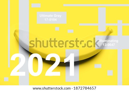 One banana on yellow background and gray stripes on it with text. Trendy colors of the year 2021 - Yellow and Gray