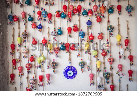 The wall decorated of ceramic colorful pomegranates - traditional fertility symbol in Turkey